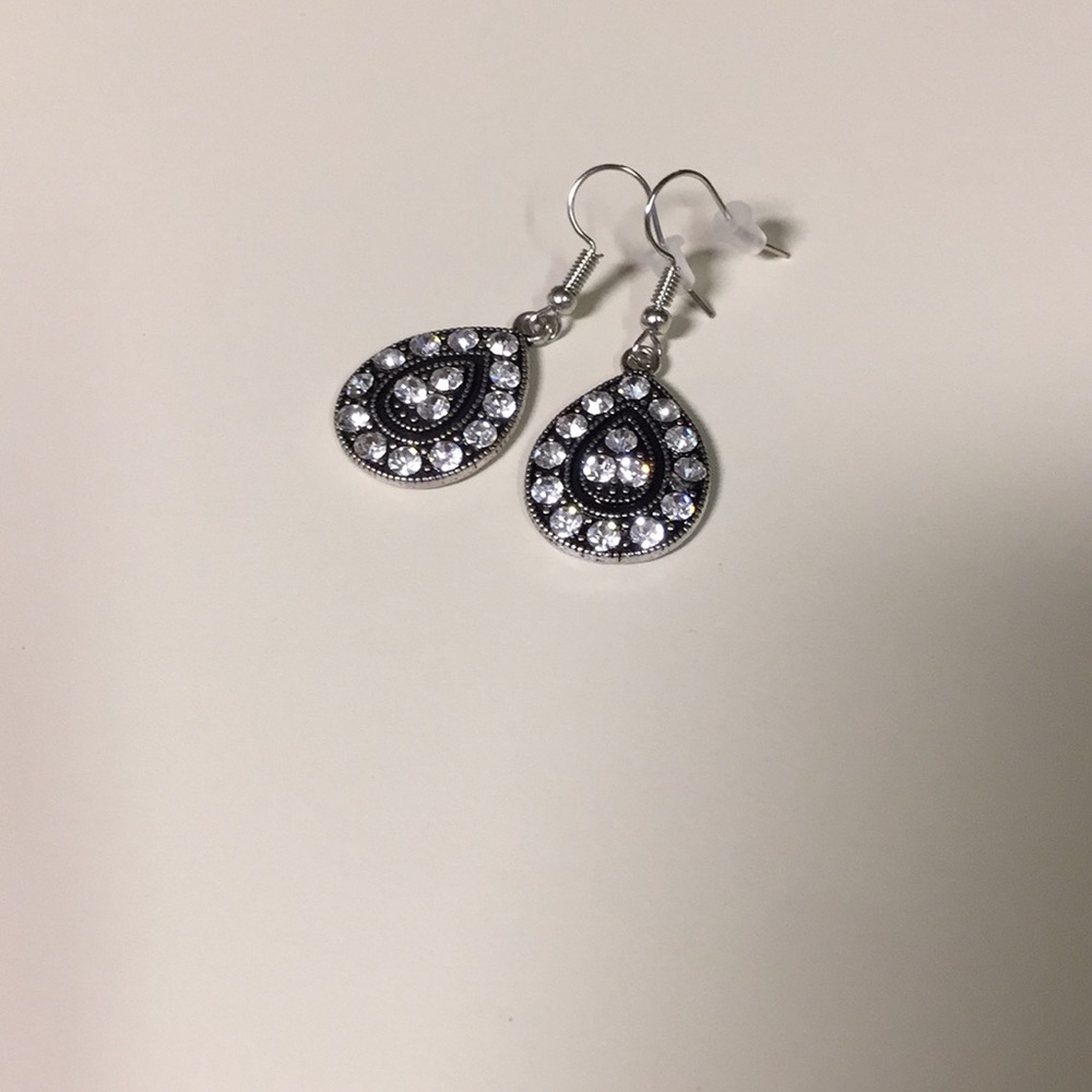 Brand new dangle statement earrings.